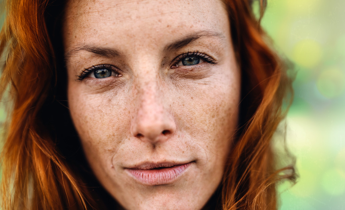 Close-up of a woman's intense face, absorbed in a profound inner experience rich with revelation